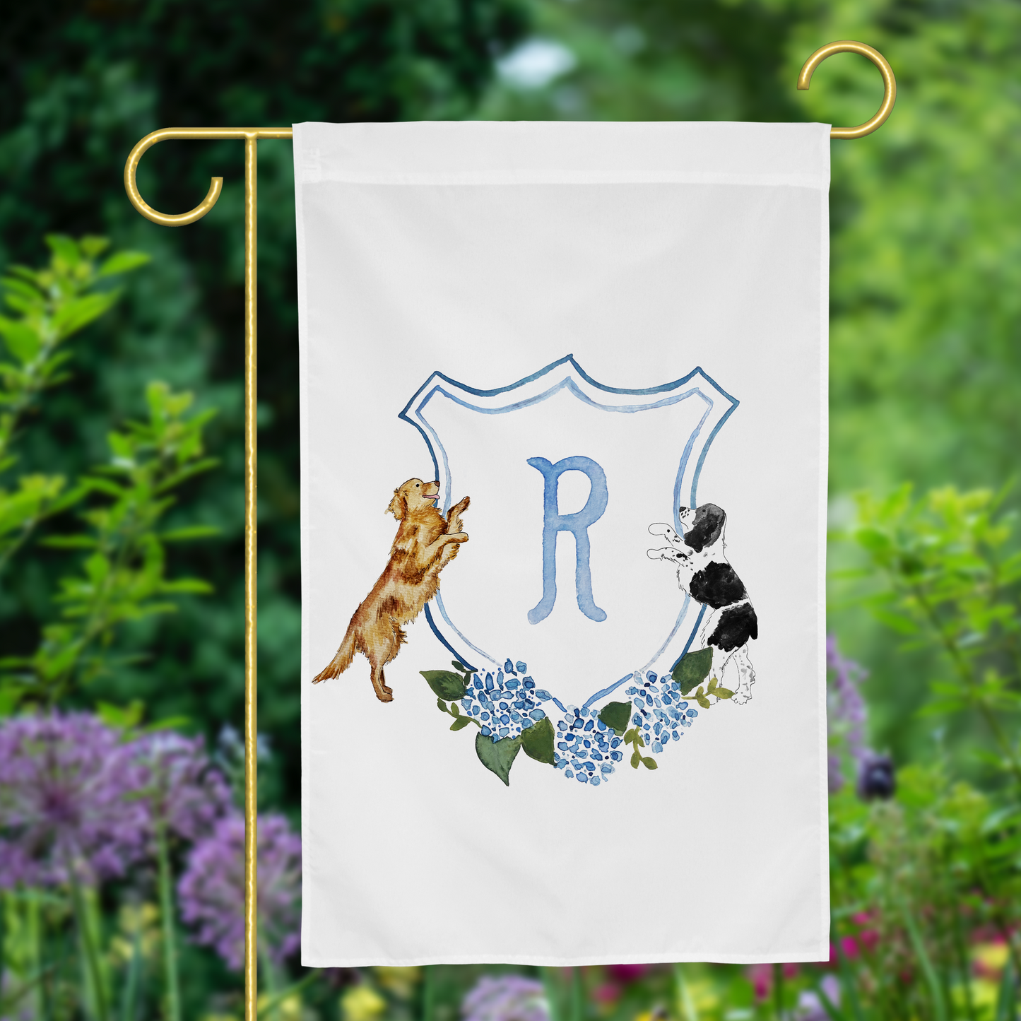 Personalized garden flag with watercolor hydrangea crest and two custom dogs sitting on either side, displayed in front yard.