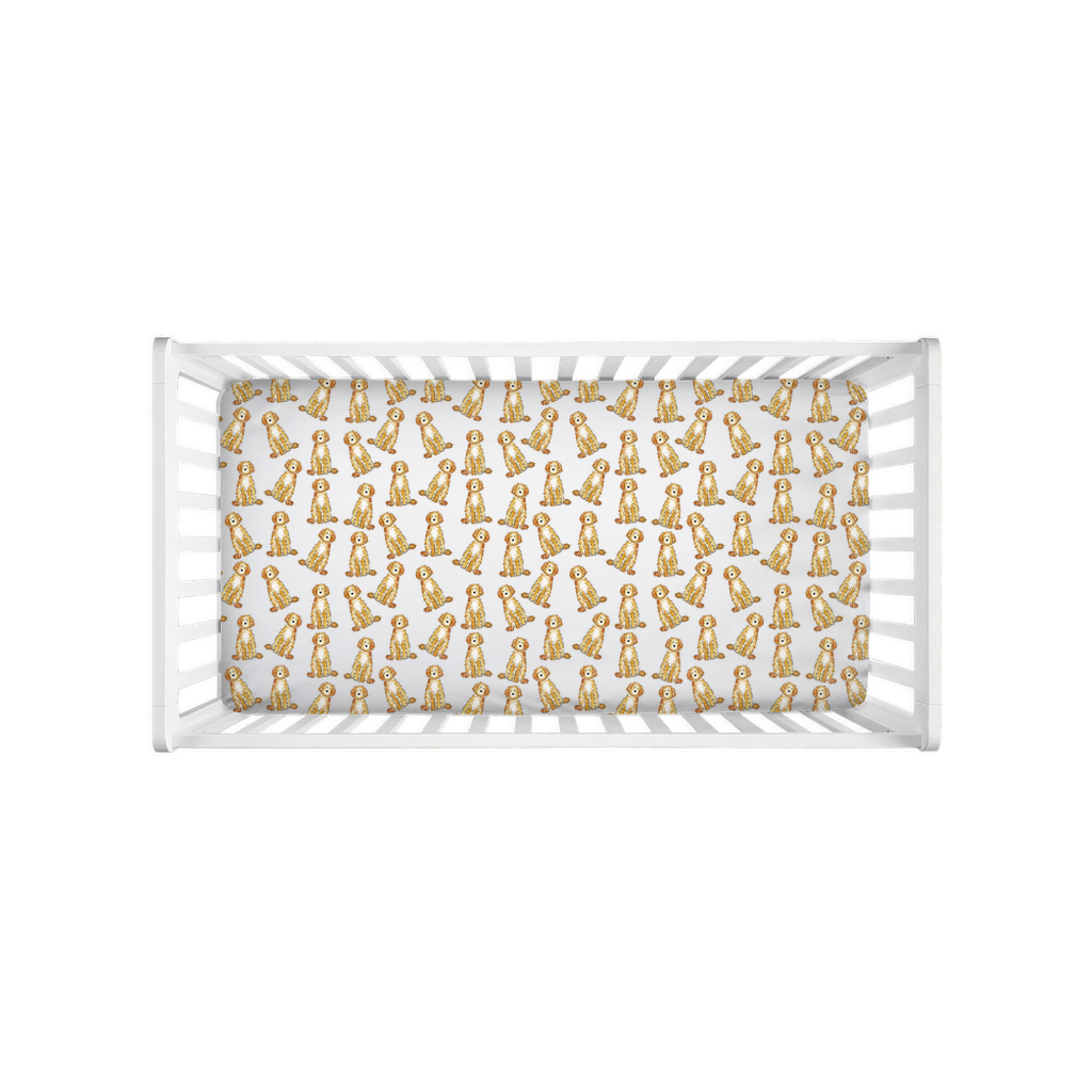 crib sheet showing Apricot and Cream Goldendoodle and Labradoodle print on soft fabric