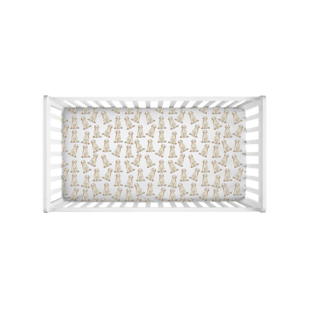 Top view of crib with fitted crib sheet featuring watercolor Cream Doodles dog pattern. cream doodle crib sheet, goldendoodle crib bedding, labradoodle nursery sheet, doodle baby crib sheet, cream goldendoodle baby bedding, dog nursery crib sheet, doodle baby gift, dog lover baby bedding, watercolor doodle crib sheet, baby shower gift dog mom, jersey knit crib sheet, cream labradoodle crib sheet, baby sheet for dog lovers, goldendoodle nursery decor, cozy baby crib sheet