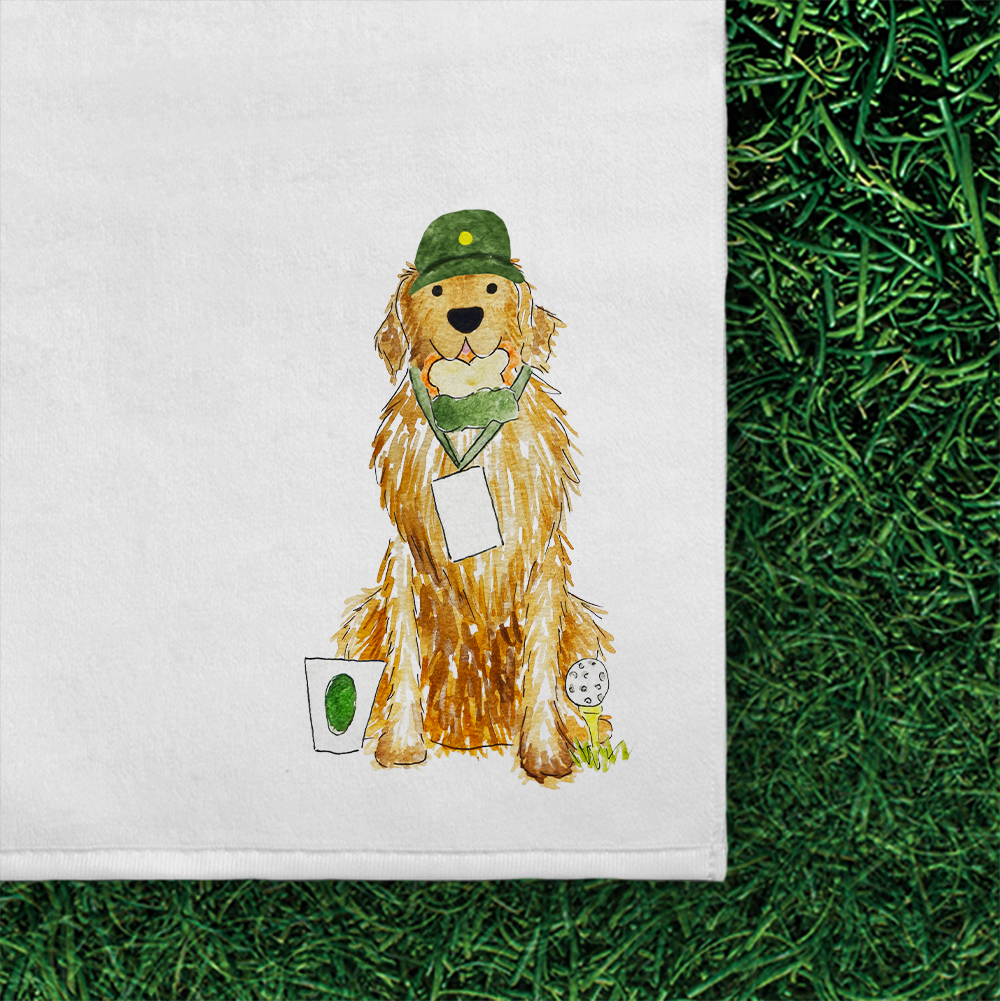 Close-up of watercolor golden retriever golf towel. Golden Retriever is dressed in a cap and patron ticket lanyard and standing with a golf tee, sandwich, and cup.