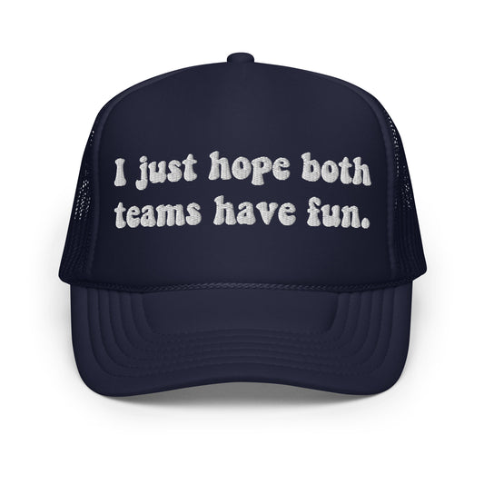 trucker hat with the phrase I just hope both teams have fun embroidered on navy foam trucker hat
