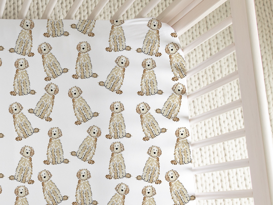Close-up of soft jersey knit crib sheet fabric with Cream Doodle watercolor print. cream doodle crib sheet, goldendoodle crib bedding, labradoodle nursery sheet, doodle baby crib sheet, cream goldendoodle baby bedding, dog nursery crib sheet, doodle baby gift, dog lover baby bedding, watercolor doodle crib sheet, baby shower gift dog mom, jersey knit crib sheet, cream labradoodle crib sheet, baby sheet for dog lovers, goldendoodle nursery decor, cozy baby crib sheet